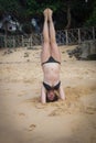 Young girl on the beach doing morning excercises Royalty Free Stock Photo