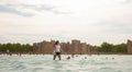 young girl on the beach, pretty girl walking on the beach, young woman running on the beach, backside view