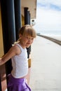 Young girl on beachside walkway