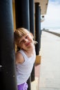 Young girl on beachside walkway