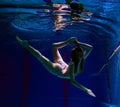 Young girl in beautiful bikini posing underwater Royalty Free Stock Photo