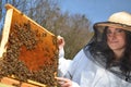 A young girl beekeeper in apiary Royalty Free Stock Photo