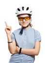 Young girl in bicycle helmet points to space, isolation on white. Royalty Free Stock Photo