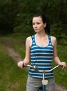 Young girl on bike in woods, Royalty Free Stock Photo