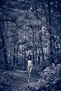 Young girl in bikini posing at the tropical forest. Sepia Royalty Free Stock Photo