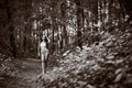 Young girl in bikini posing at the tropical forest. Sepia Royalty Free Stock Photo