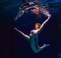 Young girl in bikini posing underwater Royalty Free Stock Photo