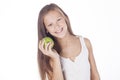 Young girl is biting a green apple. Royalty Free Stock Photo