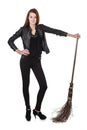 Young girl in black leather jacket holding wicked broom isolated