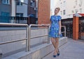 Young girl blonde in blue short dress Royalty Free Stock Photo