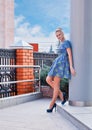 Young girl blonde in blue short dress Royalty Free Stock Photo