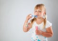 Young girl blow out soap bubbles Royalty Free Stock Photo