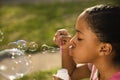 Young Girl Blowing Bubbles