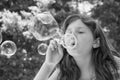 Young girl blowing bubbles Royalty Free Stock Photo