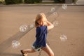 Young girl blowing bubbles outdoors Royalty Free Stock Photo