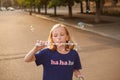 Young girl blowing bubbles outdoors Royalty Free Stock Photo