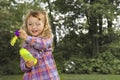 Young girl blowing soap bubbles Royalty Free Stock Photo