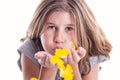 Young girl blowing yellow petals in love