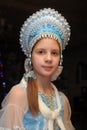 Young girl in a blue headdress Royalty Free Stock Photo