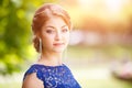 Young girl in blue lace dress looking straight Royalty Free Stock Photo