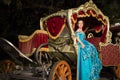 The young girl in blue old-fashioned dress sits in Royalty Free Stock Photo