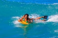 Young girl body surfing in Waikiki Beach Hawaii Royalty Free Stock Photo