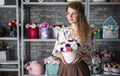 Young girl with a bouquet of roses in a flower shop. Royalty Free Stock Photo