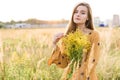 Girl with nosegay in field Royalty Free Stock Photo