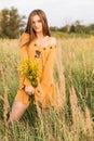 Girl with nosegay in field Royalty Free Stock Photo