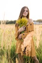 Girl with nosegay in field Royalty Free Stock Photo