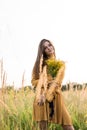 Girl with nosegay in field Royalty Free Stock Photo