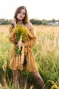 Girl with nosegay in field Royalty Free Stock Photo