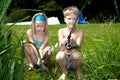 Young girl and boy fishing Royalty Free Stock Photo