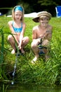 Young girl and boy fishing Royalty Free Stock Photo