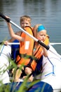 Young girl and boy at a lake Royalty Free Stock Photo