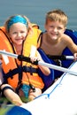 Young girl and boy at a lake Royalty Free Stock Photo
