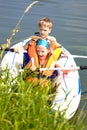 Young girl and boy at a lake Royalty Free Stock Photo