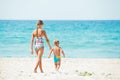 Young girl and boy playing happily at pretty beach Royalty Free Stock Photo