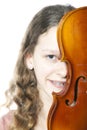 Young girl with braces behind violin Royalty Free Stock Photo