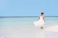 Young Girl In Bridesmaid Dress Walking On Beautiful Beach Royalty Free Stock Photo