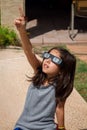 Young Girl Pointing To the Sky While Wearing Eclipse Glasses On Royalty Free Stock Photo