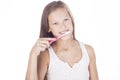 Young girl is brushing her teeth.