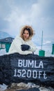 Young girl  at bumla pass india china border milestone board Royalty Free Stock Photo