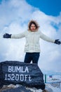 Young girl  at bumla pass india china border milestone board Royalty Free Stock Photo