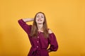 Young girl in burgundy bluse with bow laughing Royalty Free Stock Photo