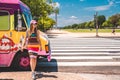 Young girl buying ice cream in an ice cream truck near Washington monument on sunny day with blue sky background