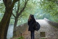 Young girl carry guitar bag while walking alone i nature