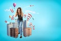 Young girl in casual clothes making brain explosion gesture with city skyscrapers and hot air balloons on blue Royalty Free Stock Photo