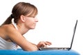 Young girl chatting using her laptop Royalty Free Stock Photo