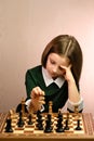 Young girl chess player Royalty Free Stock Photo